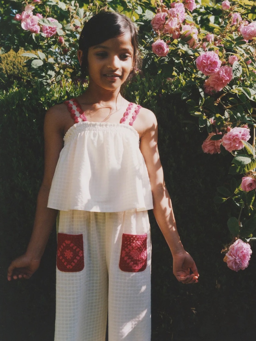 100% cotton jumpsuit with crochet pocket and straps
